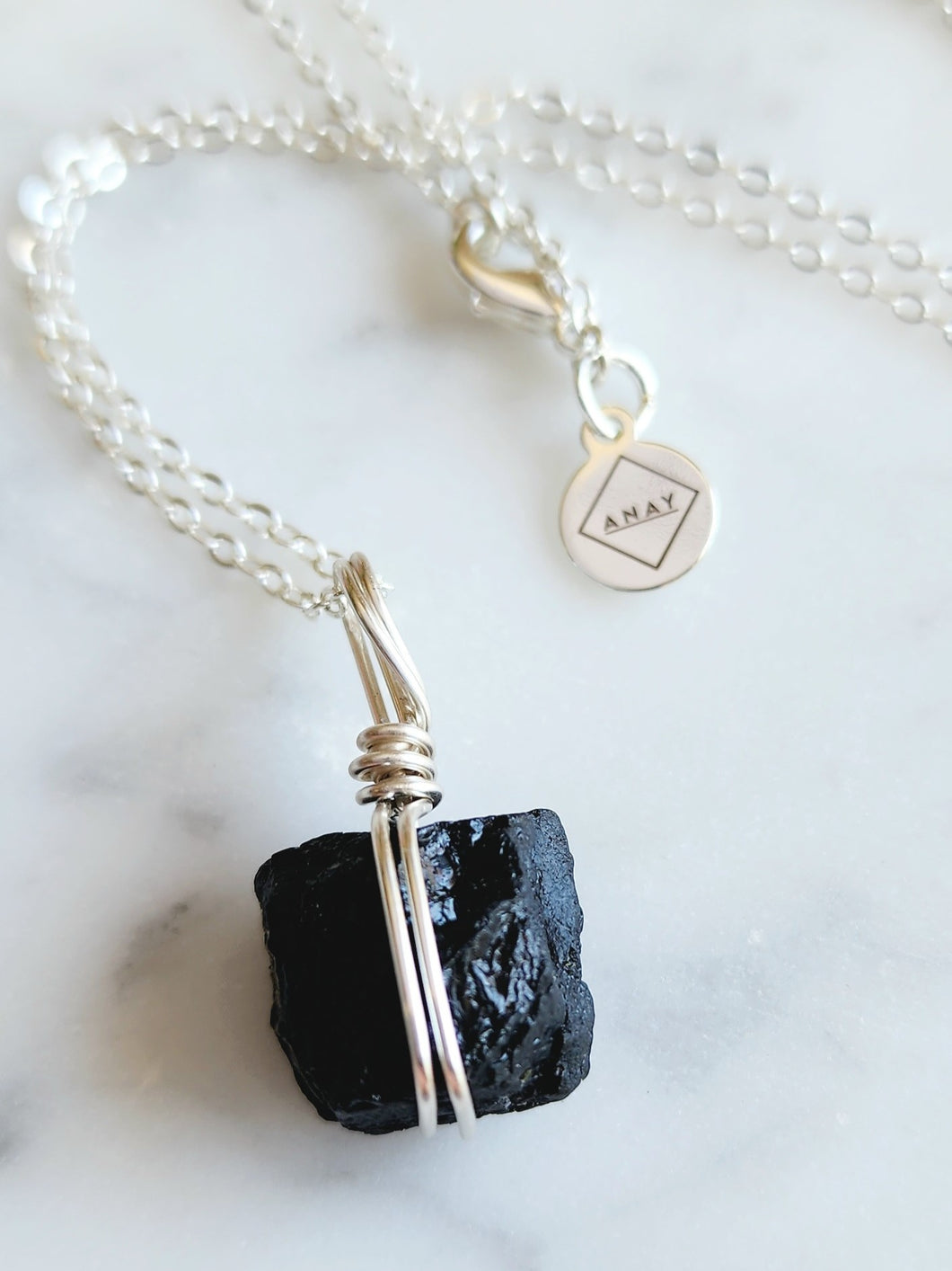 Embrace the grounding and protective energy of Black Tourmaline, a powerful ally in shielding your spirit from negativity