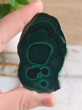 Load image into Gallery viewer, Tap into Malachite’s protective and empowering energy. Known for its vibrant green layers, Malachite not only absorbs negative energy but also enhances your spiritual journey. Perfect for manifesting with intention and clarity
