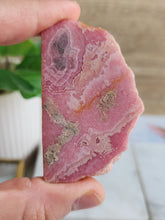 Load image into Gallery viewer, Embrace Rhodochrosite’s soothing energy to inspire compassion, harmony, and a deeper connection with your higher self
