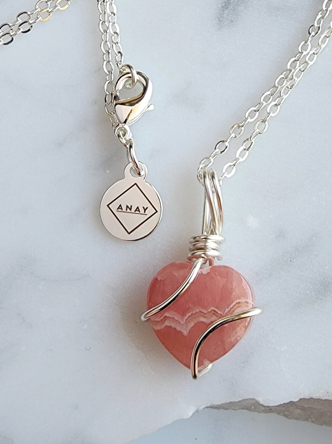 Rhodochrosite amplifies your spiritual growth and self-discovery, helping you unlock inner wisdom and connect with your higher self. Embrace its soothing energy to invite compassion, balance, and harmony into your life, making it a cherished ally on your spiritual journey