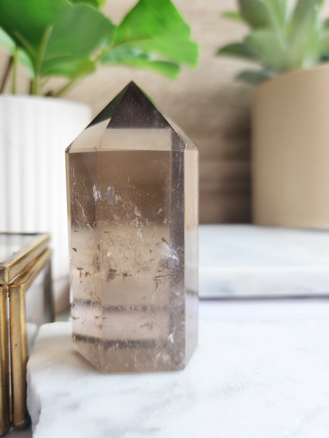 Smoky Quartz is a powerful grounding crystal that clears negativity and fosters emotional stability. Its protective energy promotes calm, clarity, and focus, making it perfect for meditation and personal growth