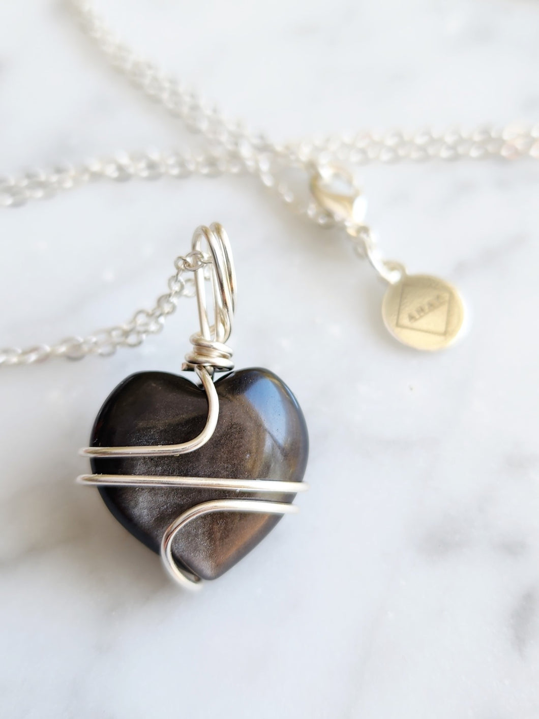 Silver Sheen Obsidian enhances intuition, mental clarity, and spiritual protection. It reveals hidden truths, helps with manifestation, and grounds your energy